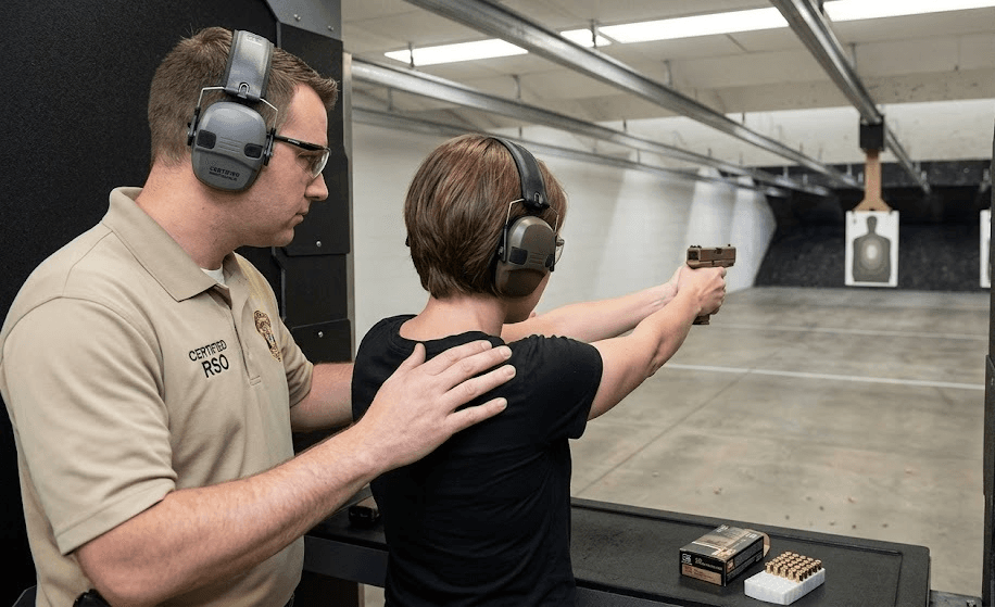 First-time shooter with Range Safety Officer guidance